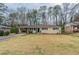 Charming single-story home featuring a well-maintained lawn and a covered carport at 3202 Betty Cir, Decatur, GA 30032
