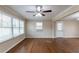 Bright living room featuring hardwood floors, neutral walls, and large windows at 3202 Betty Cir, Decatur, GA 30032