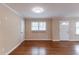 Open living room with gleaming hardwood floors and abundant natural light at 3202 Betty Cir, Decatur, GA 30032