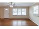 Inviting living room with gleaming hardwood floors and natural light from large windows at 3202 Betty Cir, Decatur, GA 30032