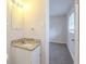 Bathroom with granite countertop, neutral walls, vanity mirror, and view into an adjacent bedroom at 3465 Tulip Dr, Decatur, GA 30032