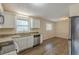 Updated kitchen features granite countertops, stainless steel appliances, and sleek flooring, perfect for modern living at 3465 Tulip Dr, Decatur, GA 30032