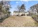 A spacious backyard with a fence and a deck that has stairs leading down to the lawn at 72 Polar Rock Rd, Atlanta, GA 30315