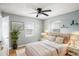 Cozy bedroom with a ceiling fan, natural light, and neutral decor at 72 Polar Rock Rd, Atlanta, GA 30315