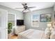 Comfortable bedroom featuring a ceiling fan, two windows, and neutral decor at 72 Polar Rock Rd, Atlanta, GA 30315