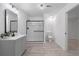 Modern bathroom with a walk-in shower and vanity, featuring neutral walls and modern fixtures at 7065 Walnut Mill Ct, Cumming, GA 30040