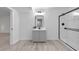 Modern bathroom featuring walk-in shower, vanity, and stylish fixtures for a sleek design at 7065 Walnut Mill Ct, Cumming, GA 30040