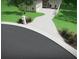 Charming home with a long driveway and well-manicured lawn showcasing a welcoming entrance at 7065 Walnut Mill Ct, Cumming, GA 30040