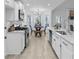 Modern kitchen with stainless steel appliances, granite countertops, and a breakfast nook with natural light at 7065 Walnut Mill Ct, Cumming, GA 30040