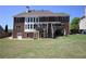 Expansive backyard features a brick house with a covered deck, perfect for outdoor entertaining at 838 Natchez Valley Trce, Grayson, GA 30017