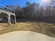 Spacious backyard featuring a patio and lush green lawn, perfect for outdoor activities at 838 Natchez Valley Trce, Grayson, GA 30017