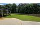 Expansive backyard featuring a well-maintained lawn and a classic wood fence at 838 Natchez Valley Trce, Grayson, GA 30017