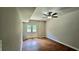 Finished basement area featuring walkout to backyard, ceiling fan and attractive wood look floors at 838 Natchez Valley Trce, Grayson, GA 30017