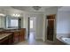 Bright and airy bathroom featuring dual sinks, granite counters, and a separate shower and tub at 838 Natchez Valley Trce, Grayson, GA 30017