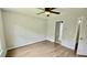 A cozy bedroom with hardwood floors, neutral walls, and a ceiling fan for added comfort at 838 Natchez Valley Trce, Grayson, GA 30017