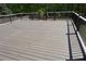 Spacious outdoor deck with wood railings, providing an ideal space for outdoor entertaining and relaxation at 838 Natchez Valley Trce, Grayson, GA 30017