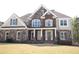 Charming brick and stone facade with well-maintained landscaping enhancing curb appeal at 838 Natchez Valley Trce, Grayson, GA 30017