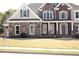 Beautiful two-story home featuring a combination of brick and stone with a manicured lawn and tasteful landscaping at 838 Natchez Valley Trce, Grayson, GA 30017