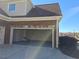 A clean, open garage showcasing epoxy floors and ample space for vehicles and storage at 838 Natchez Valley Trce, Grayson, GA 30017