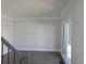 Bright interior with staircase, window, and crown molding at 838 Natchez Valley Trce, Grayson, GA 30017