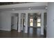 Bright, open-concept living room with hardwood floors and elegant columns at 838 Natchez Valley Trce, Grayson, GA 30017