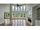 Bright living room featuring a wall of windows, hardwood floors, fireplace and built-in shelving at 838 Natchez Valley Trce, Grayson, GA 30017