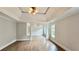 Living room featuring trey ceilings, hardwood floors, neutral paint colors, and natural light at 838 Natchez Valley Trce, Grayson, GA 30017