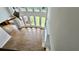 Bright living room with soaring windows, hardwood floors, and a modern ceiling fan at 838 Natchez Valley Trce, Grayson, GA 30017
