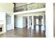 Bright living room with hardwood floors, a fireplace, and open floor plan at 838 Natchez Valley Trce, Grayson, GA 30017