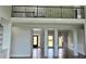 Bright and airy living room with pillars and decorative lighting and hardwood flooring at 838 Natchez Valley Trce, Grayson, GA 30017