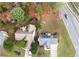 An aerial view shows two homes with well-maintained yards and mature trees at 2000 Spicers Ln, Woodstock, GA 30189