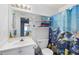 bathroom with dolphin-themed shower curtain and fish decor around the mirror at 2000 Spicers Ln, Woodstock, GA 30189