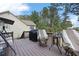 A spacious backyard deck featuring patio furniture and a natural wooded backdrop at 2000 Spicers Ln, Woodstock, GA 30189