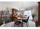 Cozy dining room featuring a wooden table set for four, with a decorative display cabinet at 2000 Spicers Ln, Woodstock, GA 30189