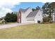 Spacious two-car garage with ample driveway parking and well-maintained lawn at 2000 Spicers Ln, Woodstock, GA 30189
