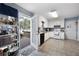 Spacious kitchen featuring white cabinets, laminate counters, and access to an outdoor deck at 2000 Spicers Ln, Woodstock, GA 30189