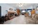 Spacious living room features brick fireplace, neutral carpet, and comfortable seating arrangement at 2000 Spicers Ln, Woodstock, GA 30189