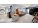 Open living space with comfortable seating, adjacent to the kitchen and dining area at 2000 Spicers Ln, Woodstock, GA 30189
