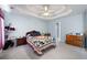 Spacious main bedroom with trey ceiling, carpet, and natural light at 2000 Spicers Ln, Woodstock, GA 30189