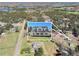 Aerial view showcases the main home with acreage, guest home, and proximity to lake at 3121 Cox Cemetery Rd, Social Circle, GA 30025
