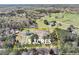 Aerial view of 5 acre estate, showcasing the house, outbuildings, and expansive land at 3121 Cox Cemetery Rd, Social Circle, GA 30025