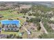 Aerial view showcasing the estate's proximity to lake, and the main home, guest home, and acreage at 3121 Cox Cemetery Rd, Social Circle, GA 30025