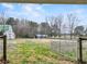 Large fenced backyard area with multiple outbuildings at 3121 Cox Cemetery Rd, Social Circle, GA 30025