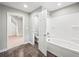 Bathroom featuring a tub-shower combo, tile floors, and an open doorway at 3121 Cox Cemetery Rd, Social Circle, GA 30025