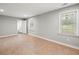 Well-lit, bare bedroom with wood-look floors, and views of the backyard at 3121 Cox Cemetery Rd, Social Circle, GA 30025