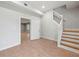 Light-filled foyer with hardwood flooring and staircase, providing a seamless transition to the rest of the home at 3121 Cox Cemetery Rd, Social Circle, GA 30025