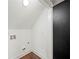 Laundry Room with washer and dryer hookups with black door and white walls at 3121 Cox Cemetery Rd, Social Circle, GA 30025