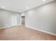 Neutral living room with wood-look floors, white trim, and recessed lighting at 3121 Cox Cemetery Rd, Social Circle, GA 30025