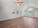 Large living room with vaulted ceilings, hardwood floors, and several windows bringing in natural light at 3121 Cox Cemetery Rd, Social Circle, GA 30025