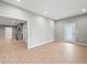 Spacious living room with hardwood-style floors, recessed lighting and a rear exterior door at 3121 Cox Cemetery Rd, Social Circle, GA 30025